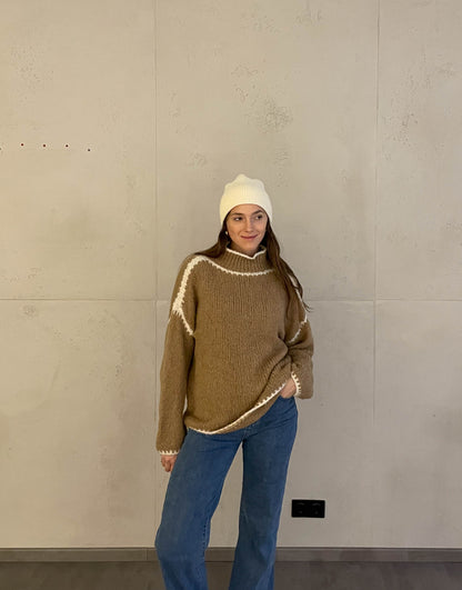 Pull avec une couture contrôlée par couleur